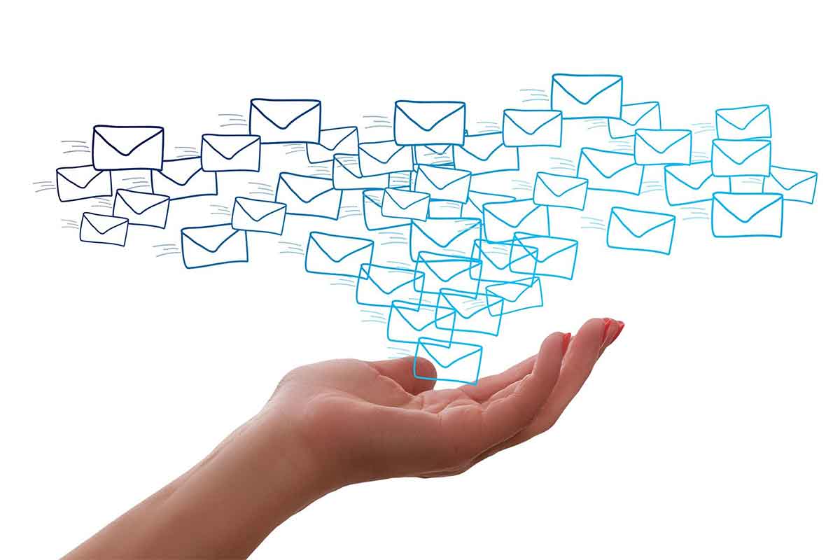Hand cradling representations of emails